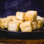 closeup of crispy fried tofu on plate