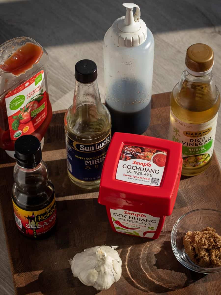 ingredients for gochujang tofu sauce set out on cutting board