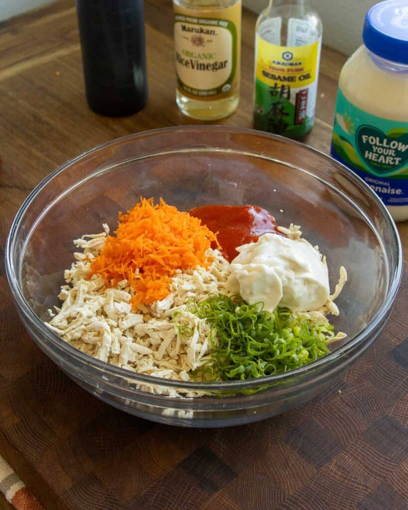 A bowl of ingredients for plant-based spicy crab salad.